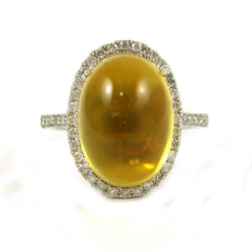 Appraisal: YELLOW BERYL AND FOURTEEN KARAT WHITE GOLD RING with round-cut