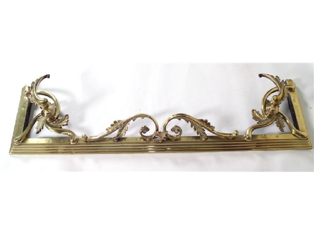 Appraisal: VICTORIAN BRASS FENDER the stepped base surmounted by boldly scrolling