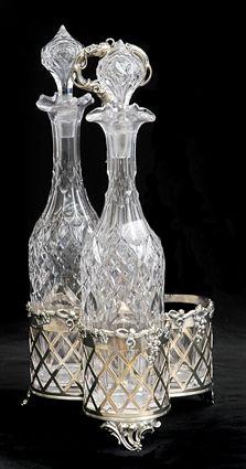 Appraisal: ENGLISH SILVER-PLATED TREFOIL BOTTLE CARRIER With pseudo hall marks the