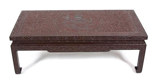 Appraisal: A Chinese Carved Black and Red Lacquer Low Coffee Table