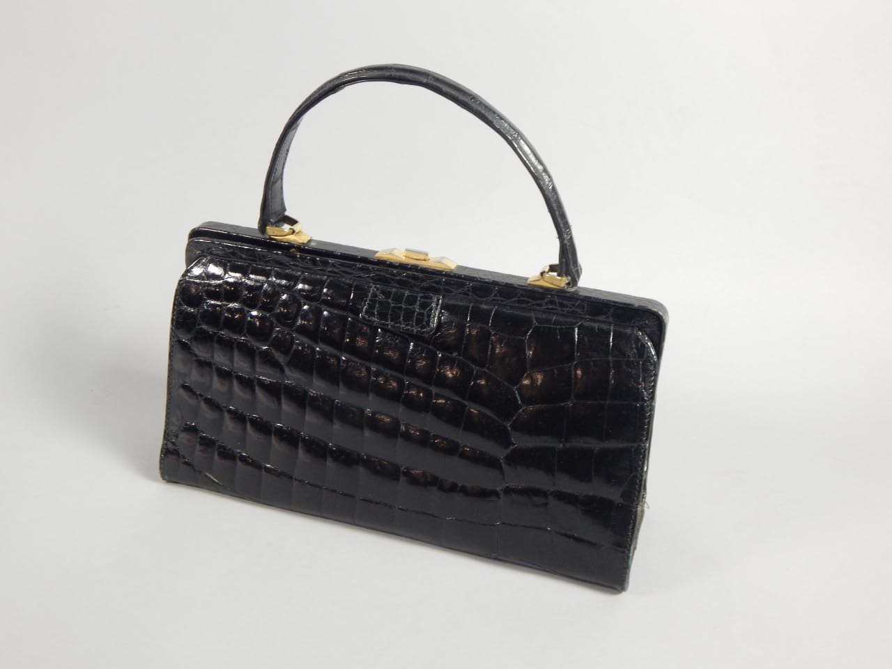 Appraisal: A s s black crocodile skin handbag with plated mounts