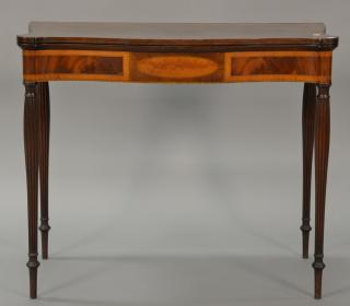 Appraisal: Sheraton mahogany game table having inlaid edges over burlwood oval