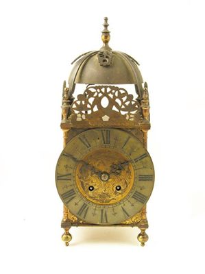 Appraisal: A brass lantern clock with an day striking movement to