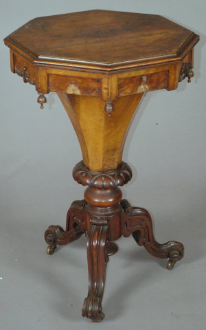 Appraisal: A Victorian walnut octagonal work table with hinged top upon