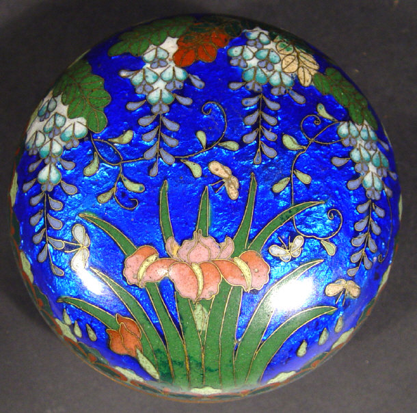 Appraisal: Oriental cloisonn bun shaped box enamelled with flowers onto a