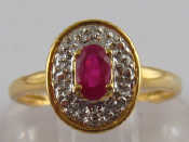 Appraisal: A yellow metal tests carat gold ruby and diamond ring