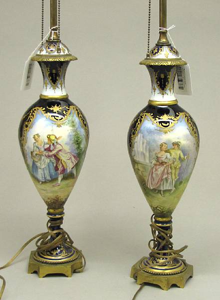 Appraisal: A pair of S vres style porcelain bronze mounted urns