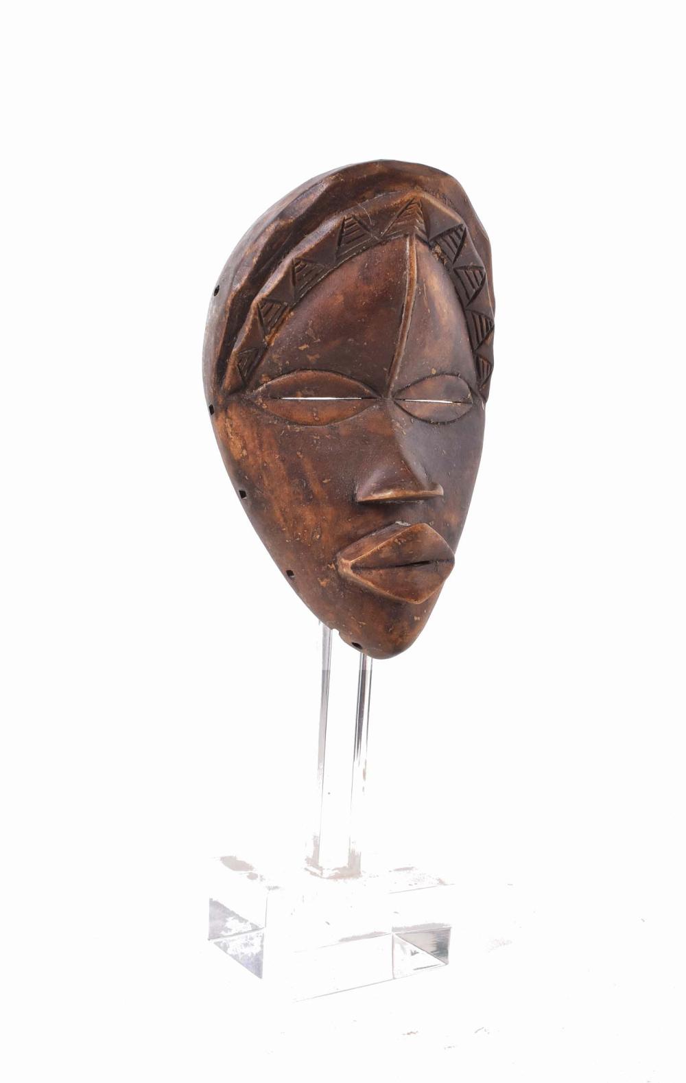 Appraisal: AFRICAN TRIBAL DAN FACE MASKCarved wood set on an acrylic