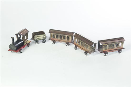 Appraisal: TIN TRAIN TOY American circa tin Locomotive tender and three