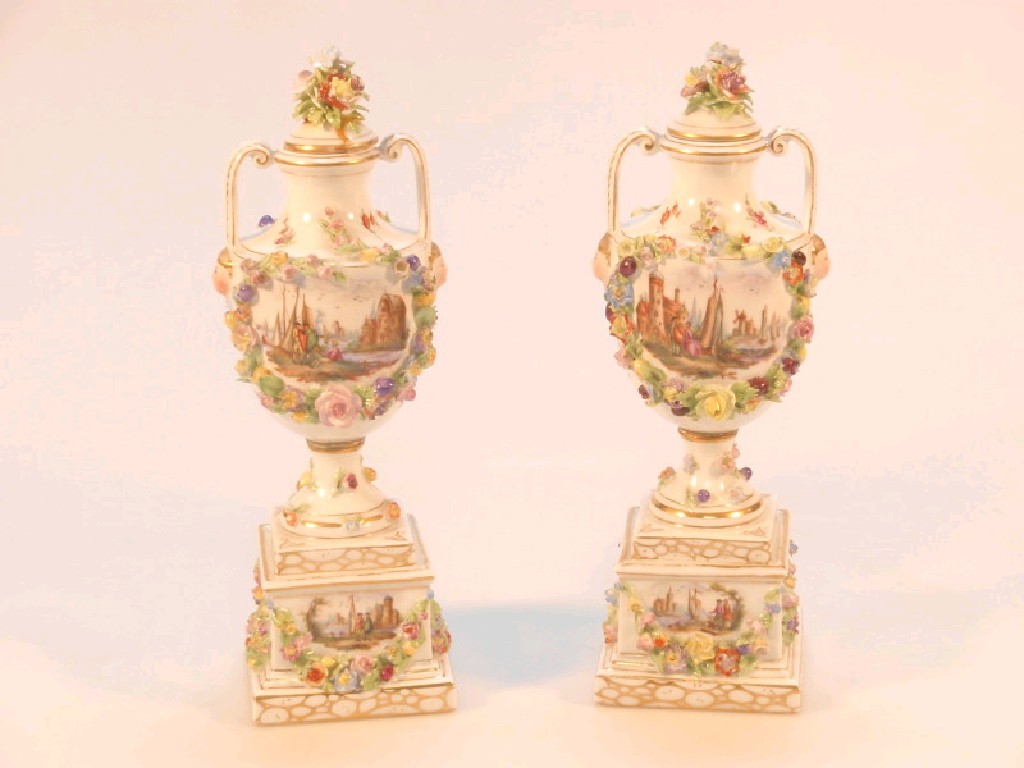 Appraisal: A pair of Carl Thieme Dresden porcelain two-handled pedestal urns