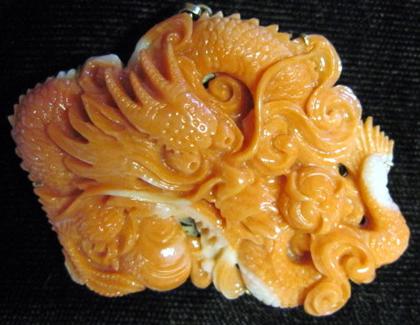 Appraisal: karat yellow gold carved coral pendantFigure of a dragon