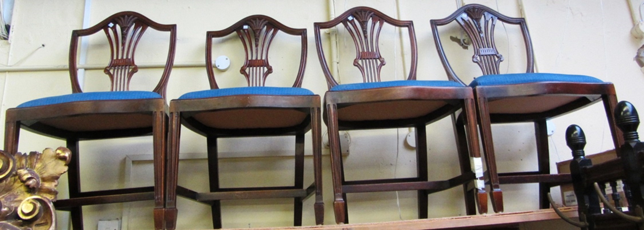 Appraisal: A set of eight mahogany framed shield back dining chairs