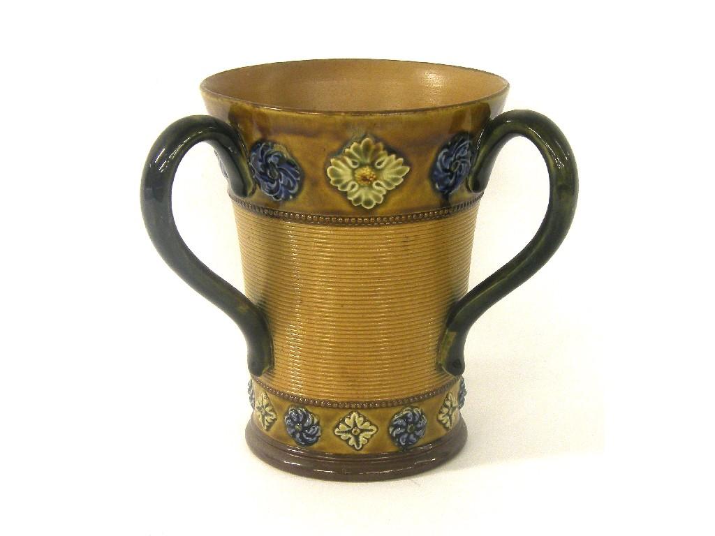 Appraisal: Royal Doulton stoneware triple handled loving cup with a central