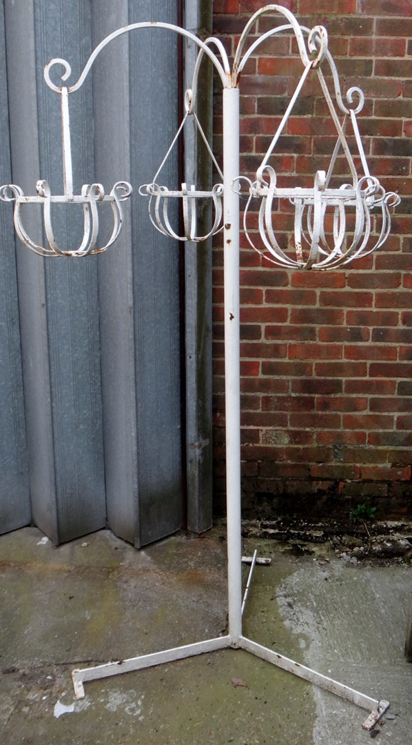 Appraisal: A pair of large white painted wrought iron hanging basket