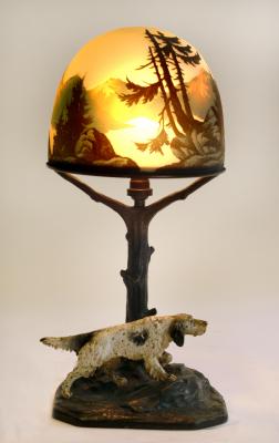 Appraisal: A COLD PAINTED BRONZE LAMP by J Gadek modelled as