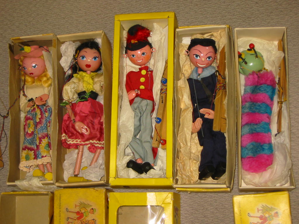 Appraisal: Five Pelham puppets SS Mitzi Caterpillar both in yellow snake