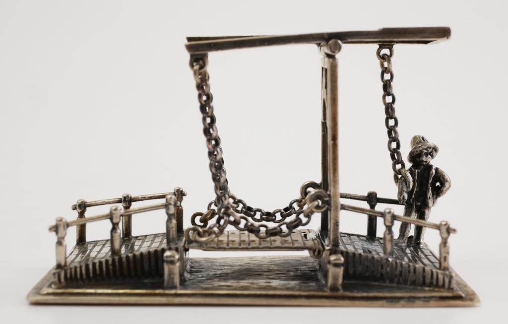 Appraisal: Miniature Netherlands silver drawbridge with bridge operator Hallmarked on base