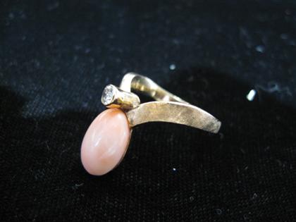 Appraisal: karat rose gold coral and diamond ringOval coral cabochon accented