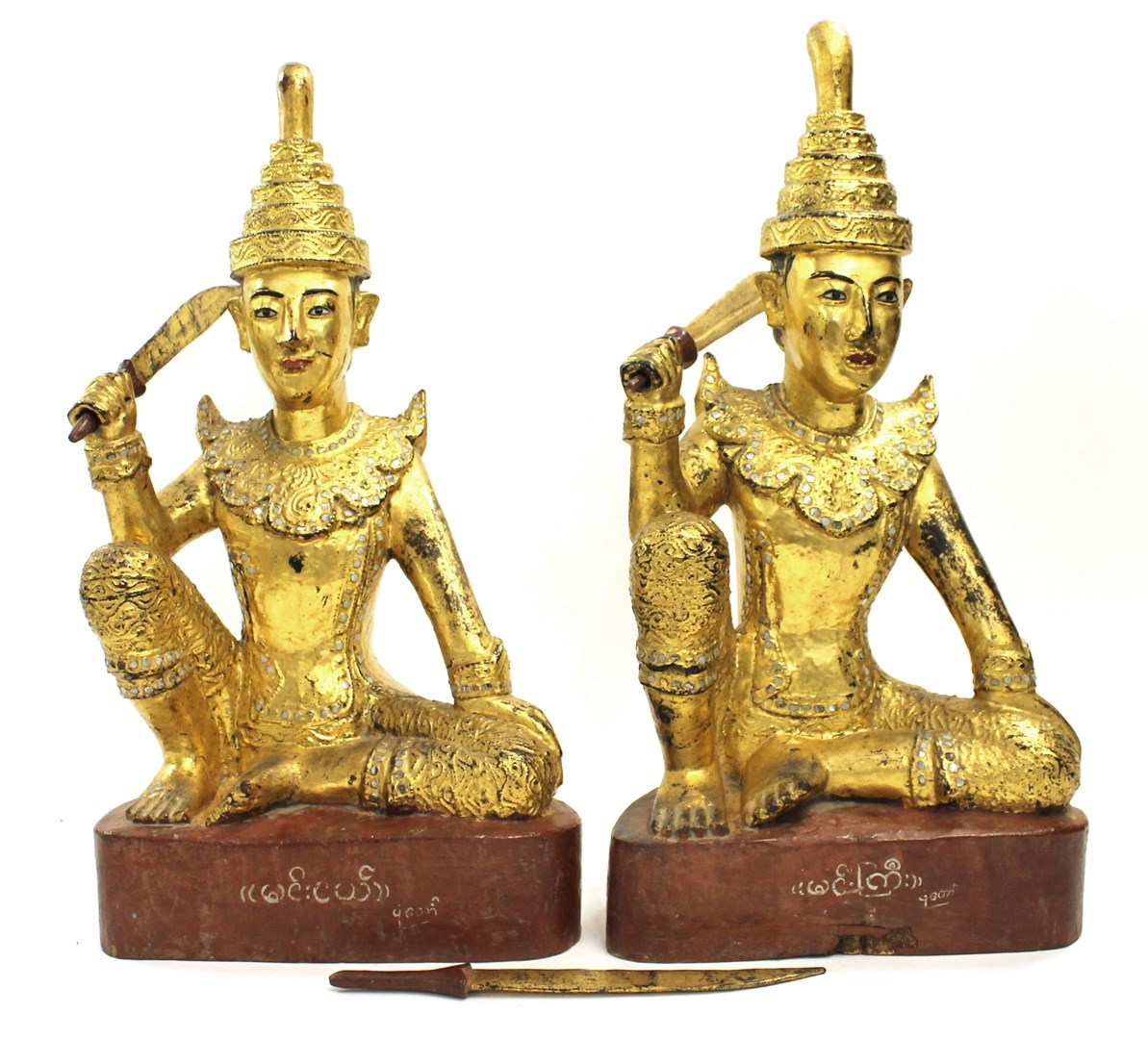 Appraisal: A pair of Thai giltwood seated figures th century each