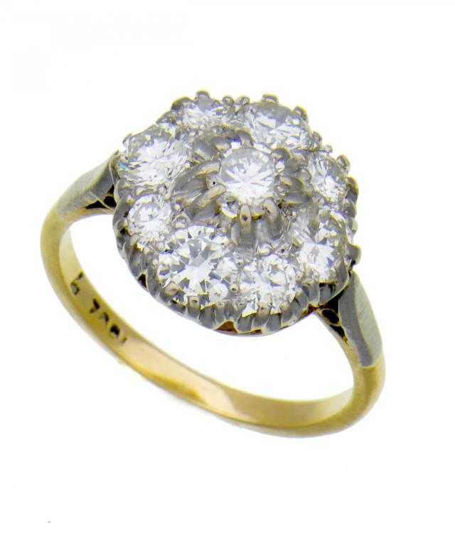 Appraisal: A DIAMOND NINE-STONE CLUSTER RING gold hoop