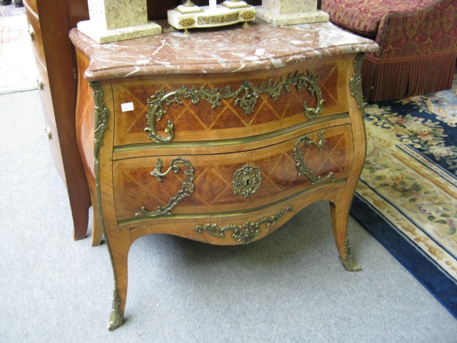 Appraisal: A Louis XV style commode the serpentine rouge marble top