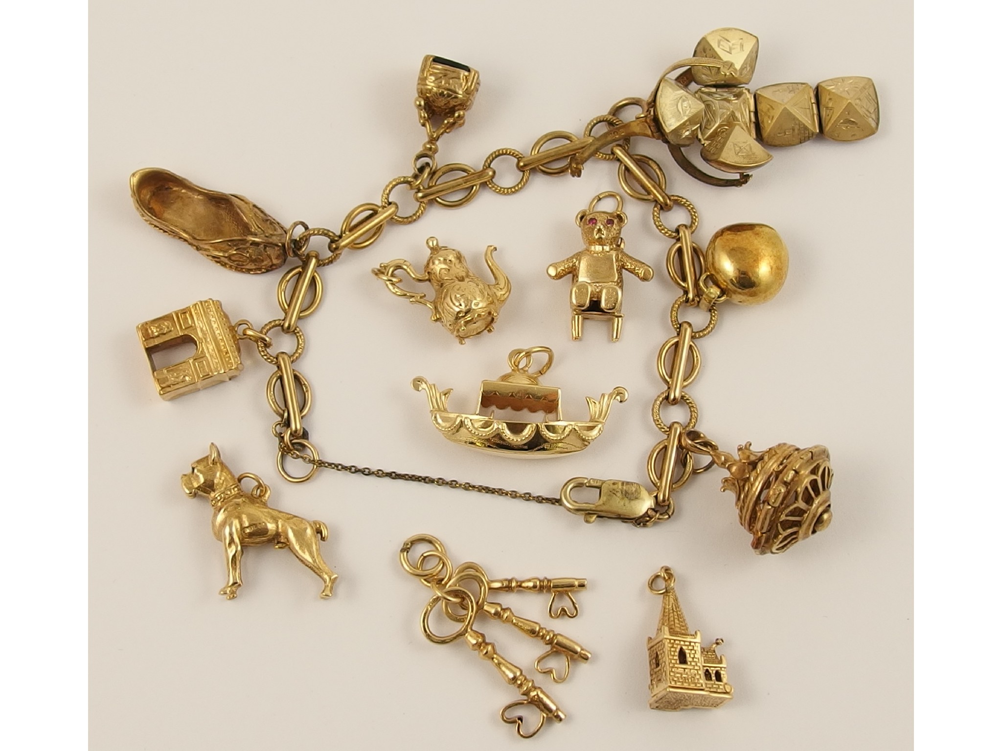 Appraisal: A ct charm bracelet with six attached charms one being