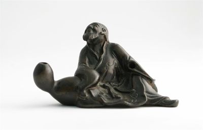 Appraisal: A small Chinese bronze model of a sage seated wearing