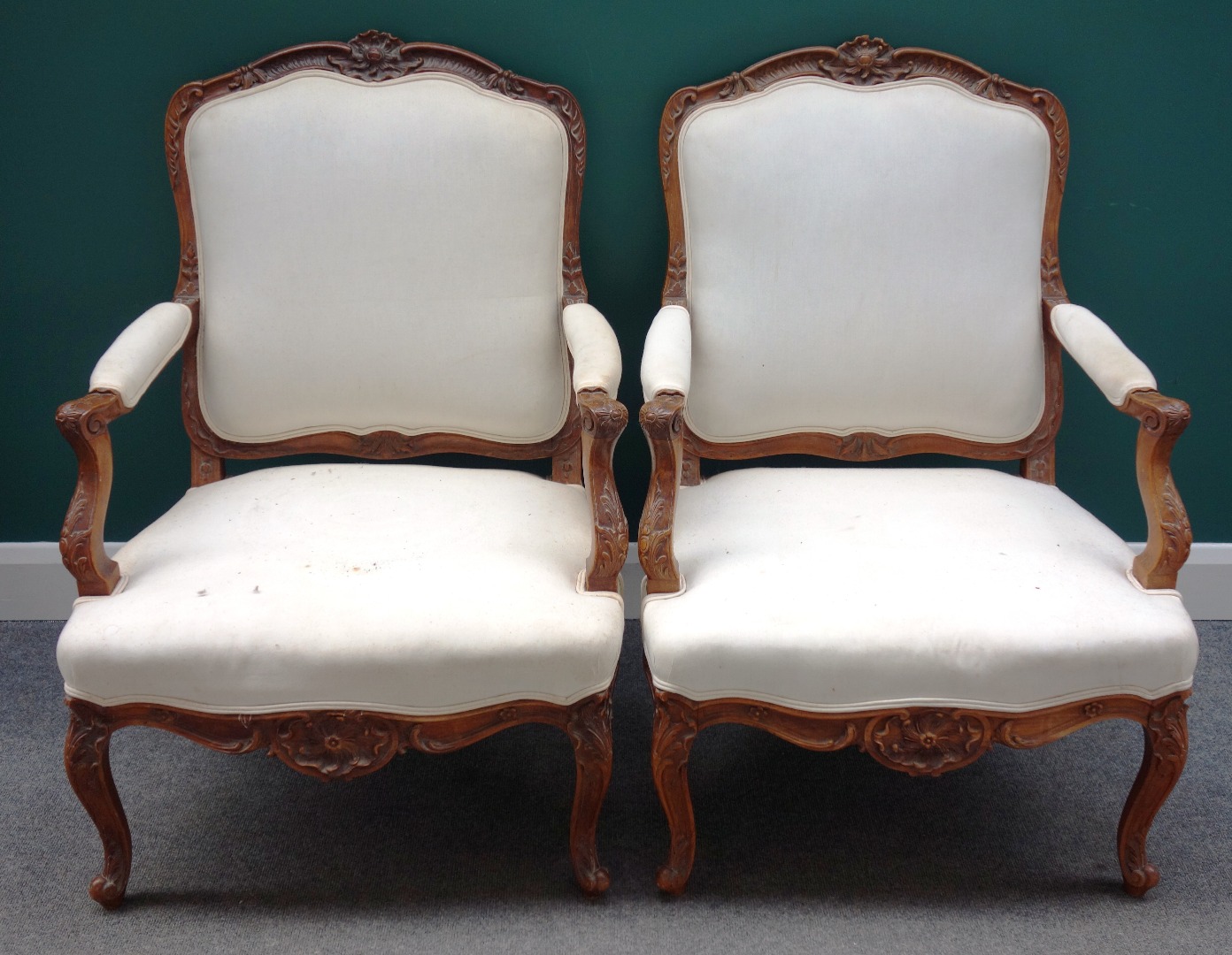 Appraisal: A pair of Louis XV style carved beech framed fauteuils