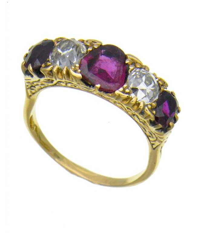 Appraisal: A RUBY AND DIAMOND FIVE-STONE RING the larger central kite