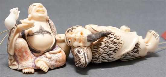 Appraisal: Two Japanese carved and painted ivory netsukes God of Good