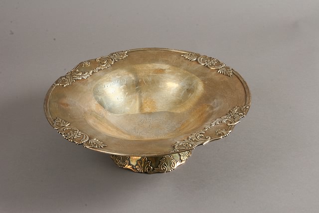 Appraisal: Circular footed form marked silver Toshikazu applied leaf scroll decoration