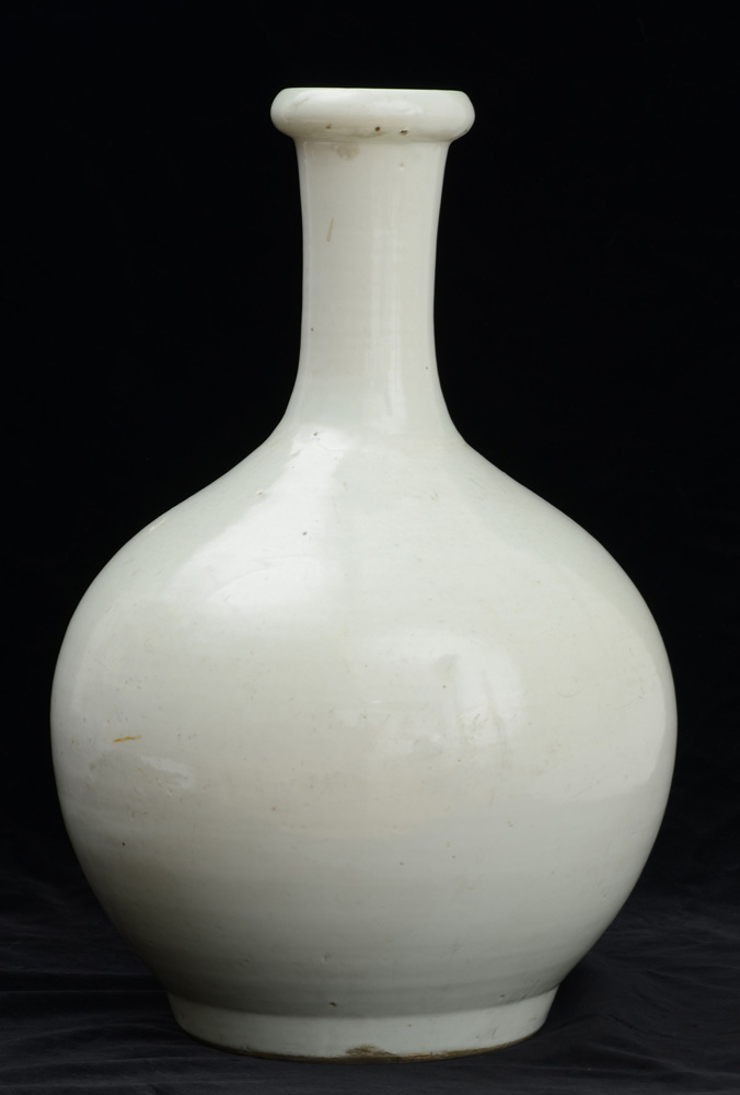 Appraisal: CHINESE IVORY-GLAZED PORCELAIN VASE Unmarked the footed spherical bowl with