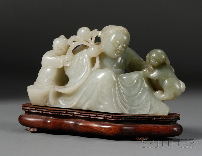 Appraisal: Jade Figural Group celadon color with one dark area carving