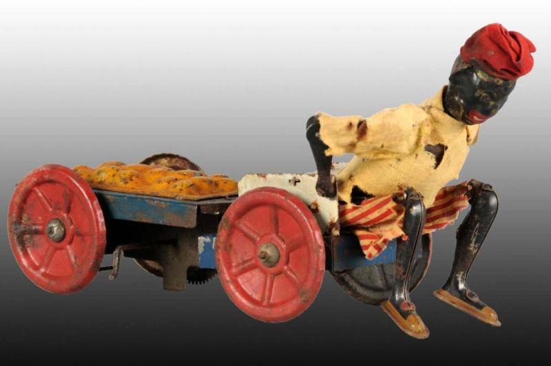 Appraisal: French Martin Wind-Up Man Pulling Cart Toy Description Works sporadically