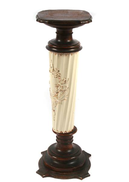 Appraisal: A carved and paint decorated pedestal height in width in