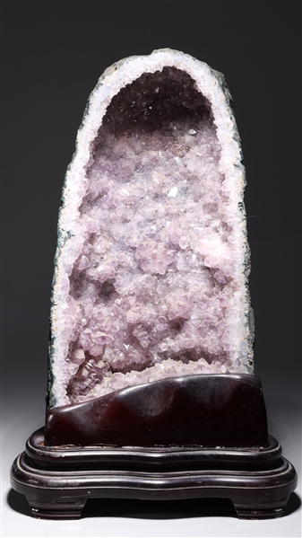 Appraisal: Amethyst geode with pale purple color with wood base some