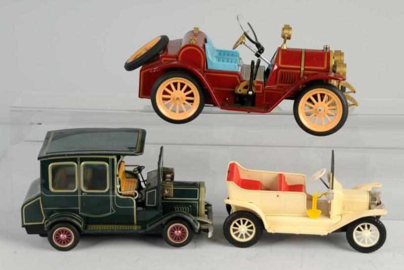 Appraisal: Lot of Tin Old-Timer Automobile Toys Description Japanese Working Includes