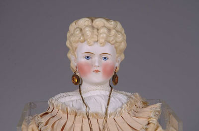 Appraisal: PARIAN DOLL A large curly haired blonde Parian on a