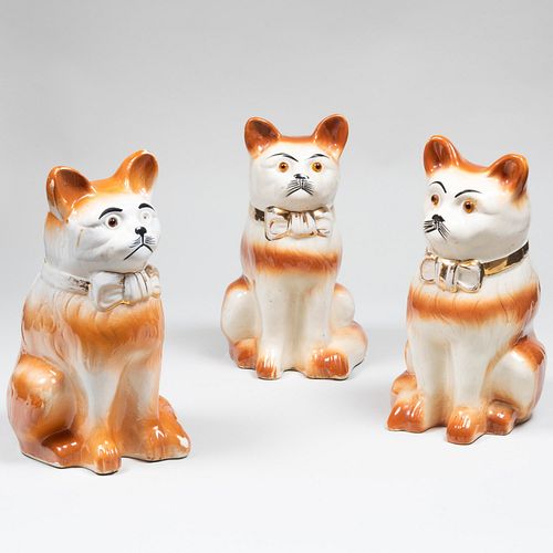 Appraisal: TWO PAIRS OF STAFFORDSHIRE CATS AND ANOTHER CATEach with inset