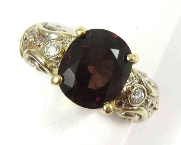 Appraisal: GARNET DIAMOND AND FOURTEEN KARAT GOLD RING The white and