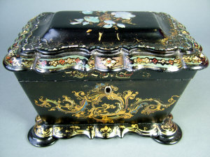 Appraisal: A Victorian papier-mache twin division tea caddy of shaped rectangular