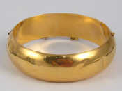 Appraisal: A yellow metal tests carat gold bangle approx mm wide