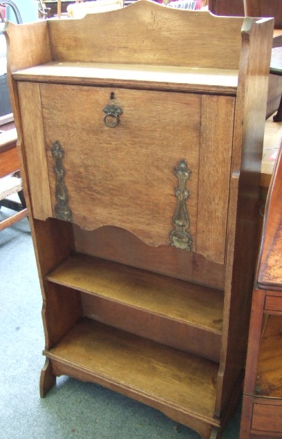 Appraisal: An early th century oak students bureau with lower bookcase