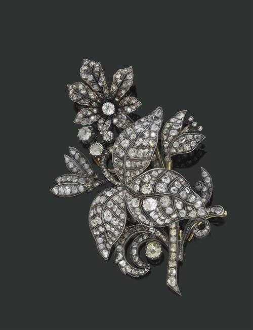 Appraisal: DIAMOND BROOCH ca Silver over yellow gold Attractive elegant brooch