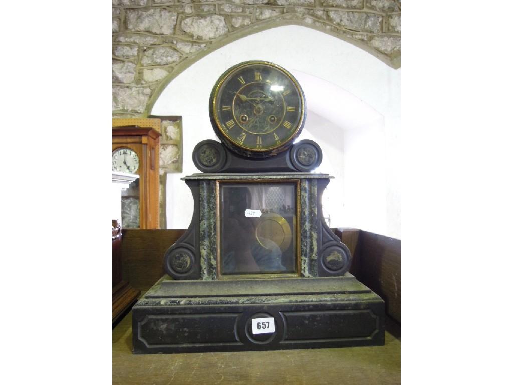 Appraisal: A late th century black slate and marble mantle clock