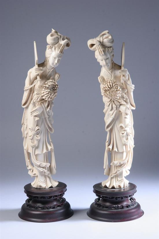 Appraisal: PAIR CHINESE IVORY FIGURES OF MEIREN Each standing holding flowering