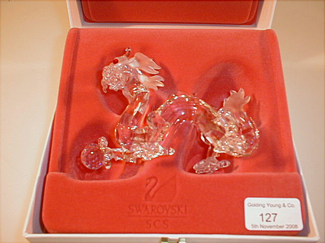 Appraisal: A Swarovski model of a dragon with red stone eyes