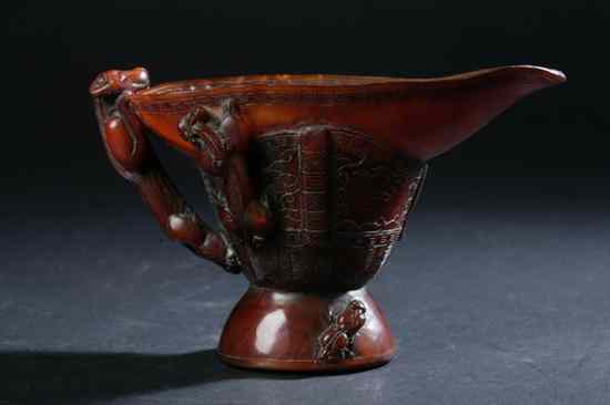 Appraisal: CHINESE HORN LIBATION CUP DRAGON DECORATION - in high