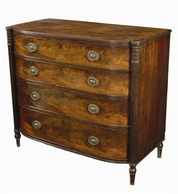 Appraisal: A Regency mahogany barrel front chest the reeded edge top