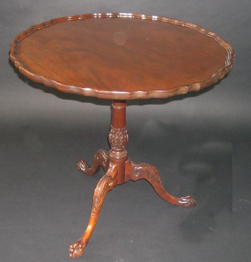 Appraisal: George III-Style Mahogany Tripod Table the dished shaped circular tilting